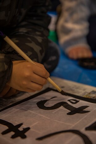 Marine Corps Air Station Iwakuni and Japanese residents, students, and leaders take part in kakizome, at Waki Elementary School, Waki Town, Japan, Jan. 11, 2019. Kakizome is the first calligraphy writing of the year that sets the writers goals for the New Year. (U.S. Marine Corps photo by Lance Cpl. Triton Lai)