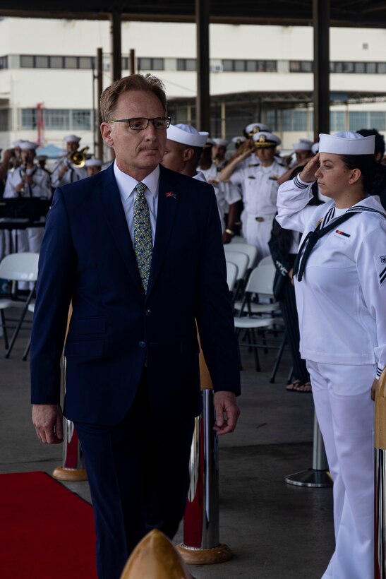 Acting Secretary of the Navy Thomas B. Modly, walks on stage during the unveiling of the new Ford-class aircraft carrier USS Doris Miller at a Dr. Martin Luther King Jr. Day ceremony, Joint Base Pearl Harbor-Hickam, Jan, 20. 2019. Marines aboard Marine Corps Base Hawaii participated alongside Sailors of various units in the ceremony. This is the second ship named after Miller, and the first aircraft carrier to be named after an African American, enlisted Sailor. (U.S. Marine Corps photo by Lance Cpl. Samantha Sanchez)