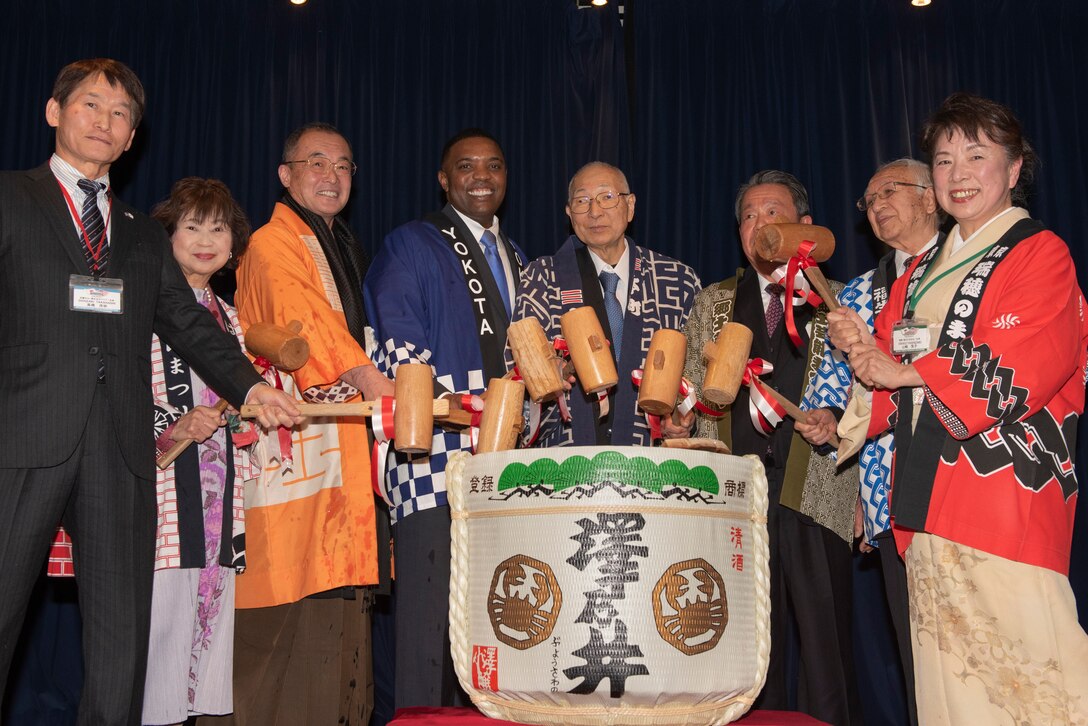 Col. Otis C. Jones, 374th Airlift Wing commander, breaks open a sake keg with the seven friendship club presidents during the Kagami-biraki ceremony, Jan.25, 2020, at Yokota Air Base, Japan.