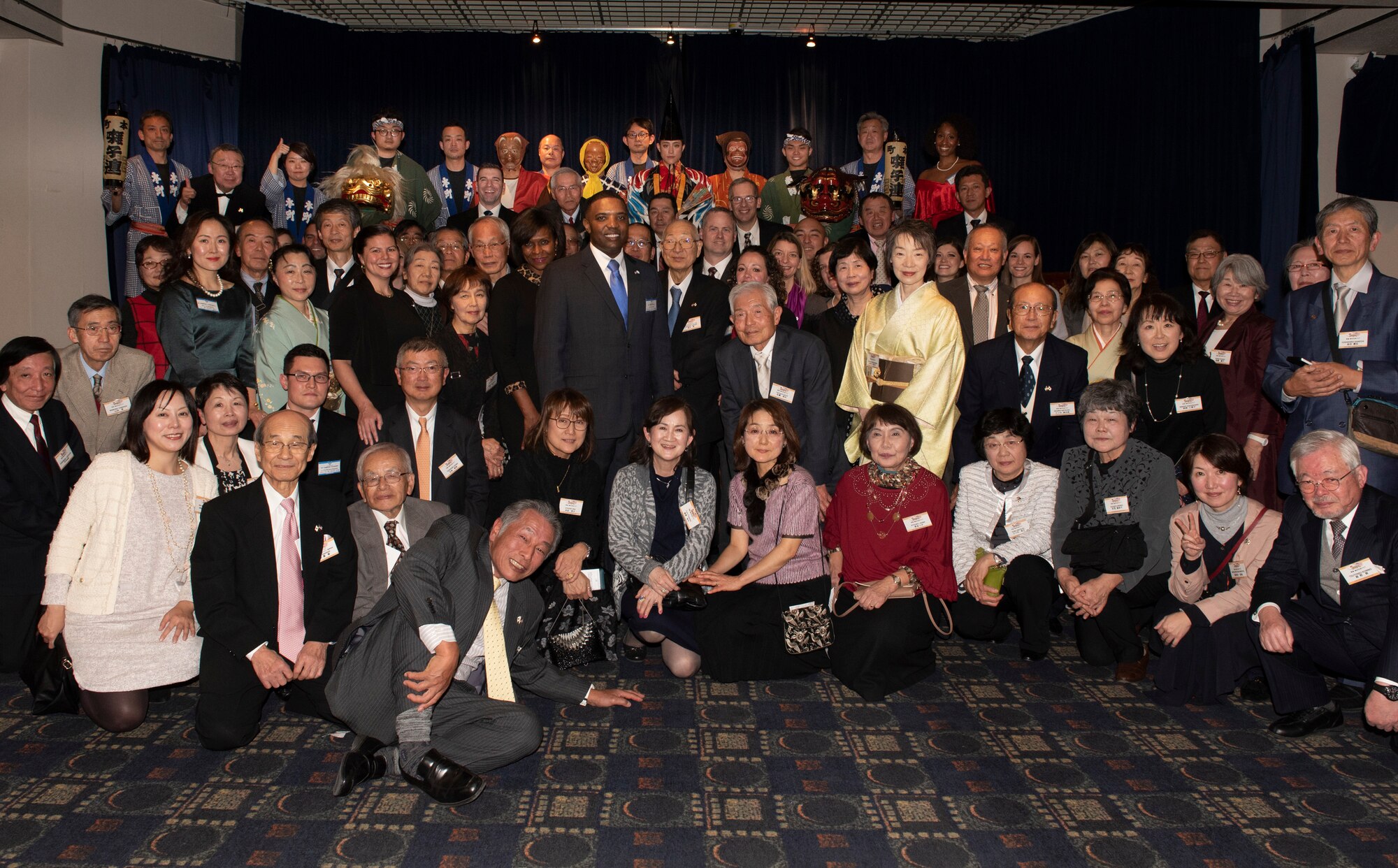 Col. Otis C.Jones, 374th Airlift Wing commander, his wife Nataki, Col. Jason Mills, 374th Airlift Wing vice commander, and his wife Kim pose for a photo along with members of the Ome-Yokota Friendship Club and its counterpart the 374th Wing Staff Agency during the U.S.-Japan Joint New Year’s Party, Jan. 25, 2020, at Yokota Air Base, Japan.