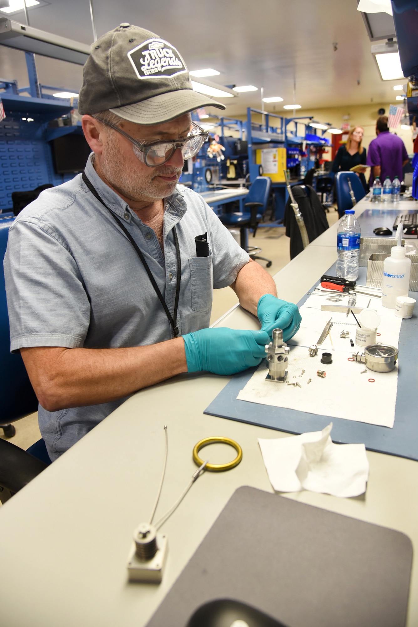 Joe Ragan, an instrument mechanic with the 550th Commodities Maintenance Squadron Oxygen Shop, disassembles a REOS, which is an emergency air/breathing system which pilots can use if they have to eject from their aircraft. Ragan disassembles the REOS, cleans each miniature item and then reassembles it for testing. (U.S. Air Force photo/Kelly White)
