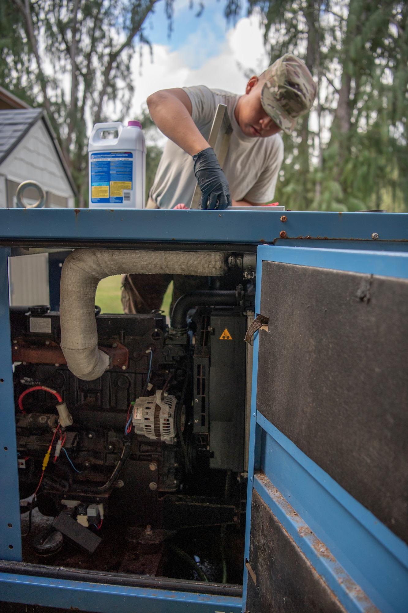 U.S. Air Force Staff Sgt. Gabriel Carias, 624th Civil Engineer Squadron electrical power production craftsman, prepares to put antifreeze into an electrical generator at Bellows Air Force Station, Hawaii, Jan. 25, 2020.