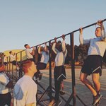 Security Forces Airmen take part in the pull-up portion of a physical fitness test on the opening day of the Air Education and Training Command Defender Challenge team tryout at Joint Base San Antonio-Lackland, Texas, Jan. 27, 2020. The five-day selection camp includes a physical fitness test, M-9 and M-4 weapons firing, the alpha warrior obstacle course, a ruck march and also includes a military working dog tryout as well.