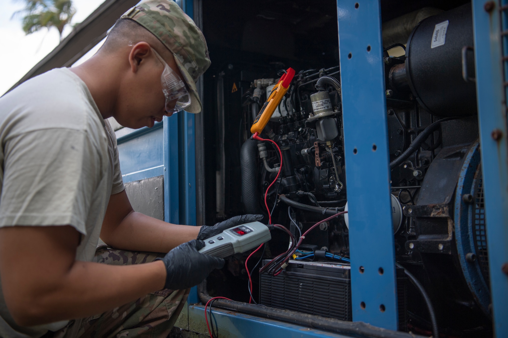 U.S. Air Force Staff Sgt. Gabriel Carias, 624th Civil Engineer Squadron electrical power production craftsman, checks the battery of an electrical generator at Bellows Air Force Station, Hawaii, Jan. 25, 2020.