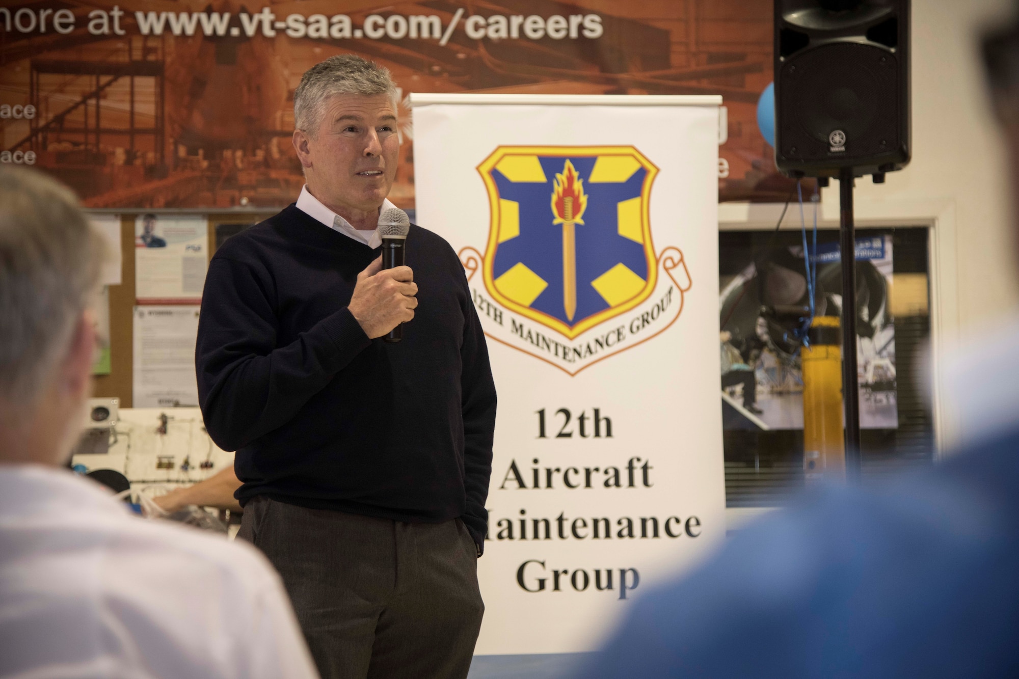 Robert J. West, 12th Maintenance Group director of maintenance, discusses the 12th MXG mission and welcomes the group’s seven new hires at the Hallmark University College of Aeronautics graduation ceremony Jan. 23, 2020. These hires were a direct result of the 12th MXG’s push for recruitment and new employees for the upcoming missions slated for JBSA-Randolph.