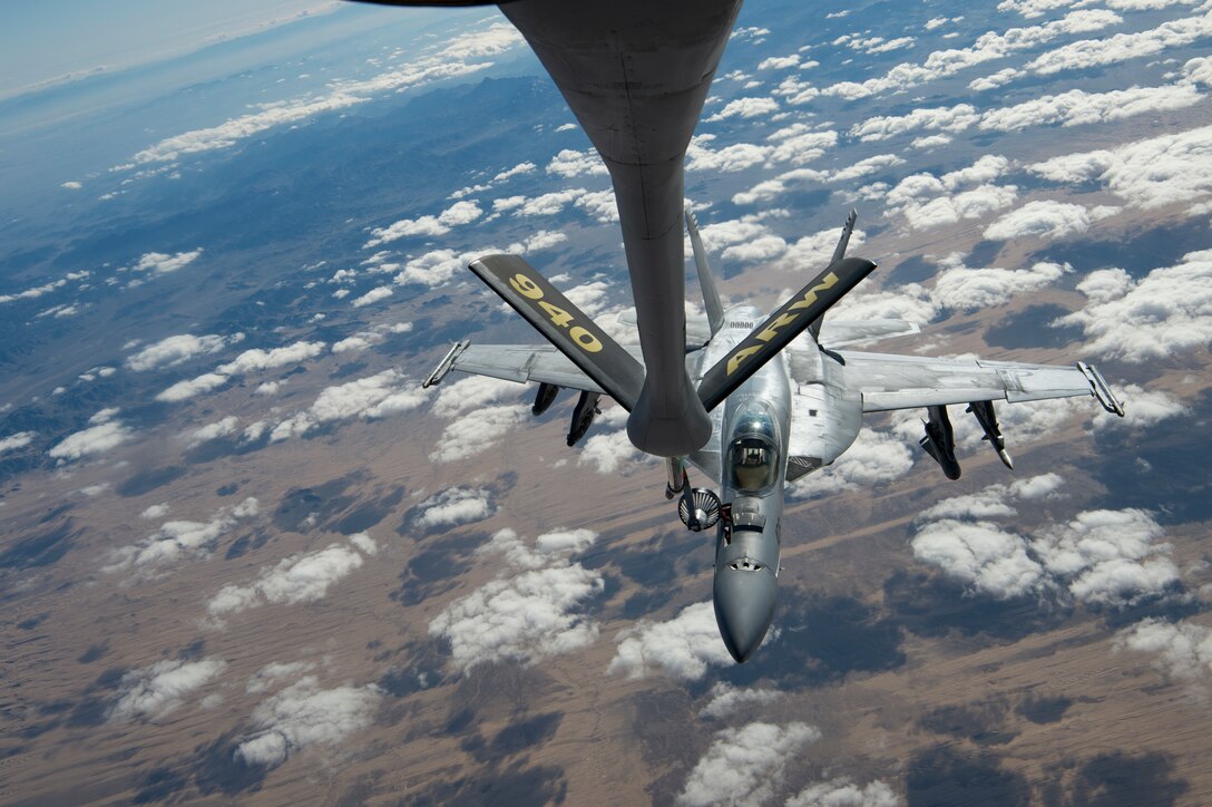 A U.S. Navy F/A-18 Super Hornet receives fuel from a KC-135 Stratotanker assigned to the 28th Expeditionary Air Refueling Squadron over Afghanistan, Jan. 14, 2020.