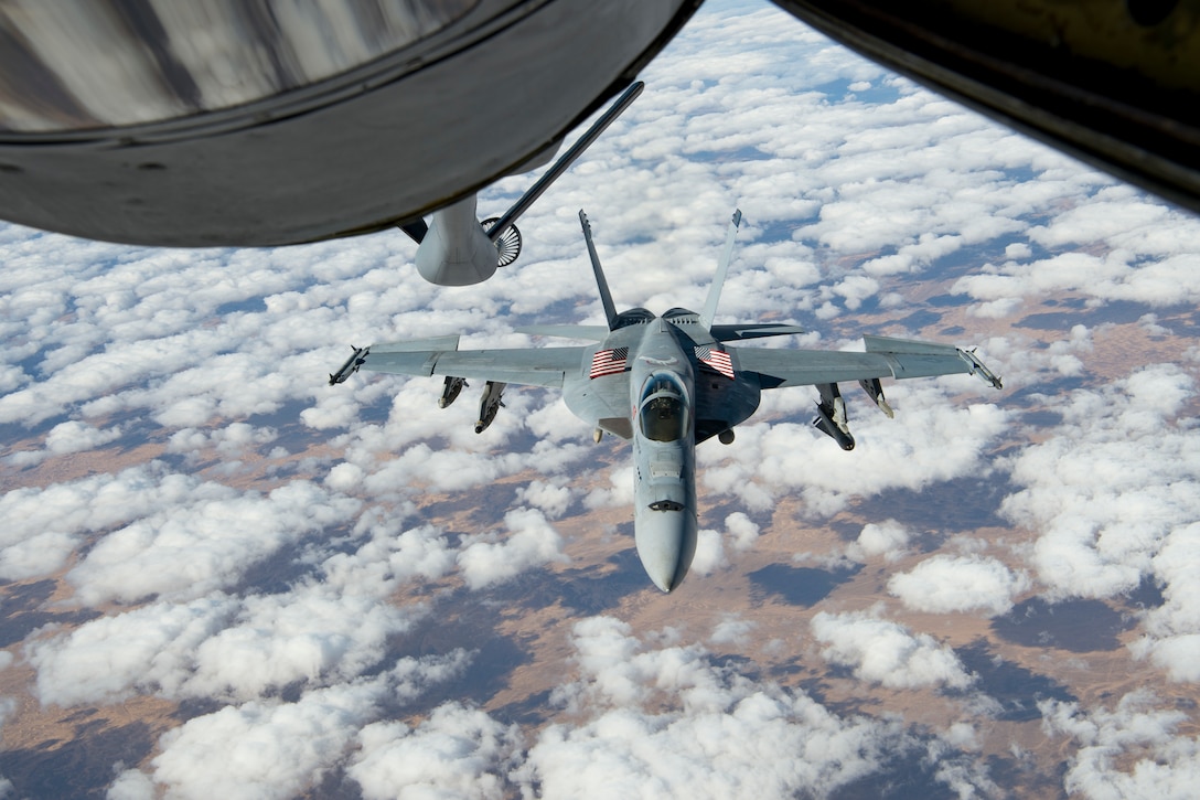 A U.S. Navy F/A-18 Super Hornet approaches a KC-135 Stratotanker assigned to the 28th Expeditionary Air Refueling Squadron to receive fuel over Afghanistan, Jan. 14, 2020.