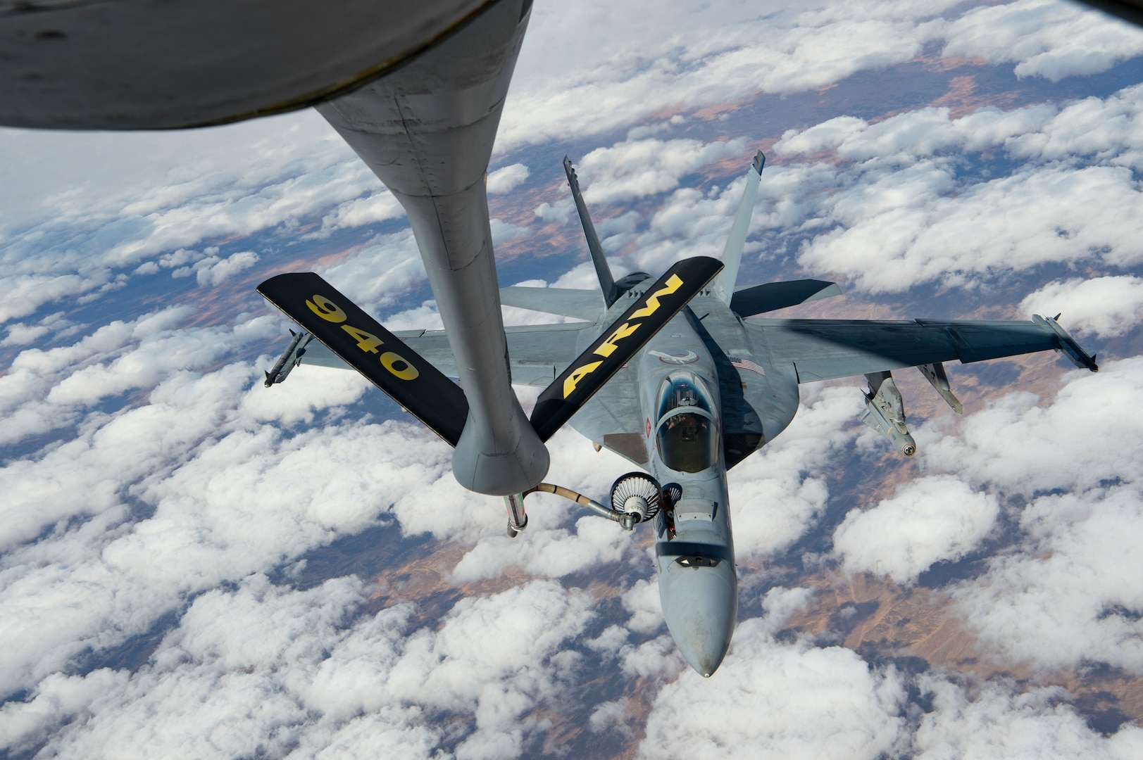 A U.S. Navy F/A-18 Super Hornet receives fuel from a KC-135 Stratotanker assigned to the 28th Expeditionary Air Refueling Squadron over Afghanistan, Jan. 14, 2020.