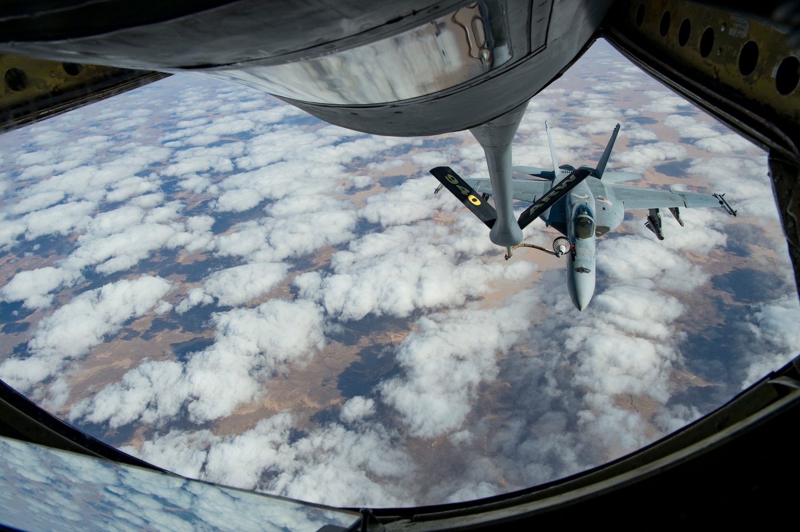 A U.S. Navy F/A-18 Super Hornet receives fuel from a KC-135 Stratotanker assigned to the 28th Expeditionary Air Refueling Squadron over Afghanistan, Jan. 14, 2020.