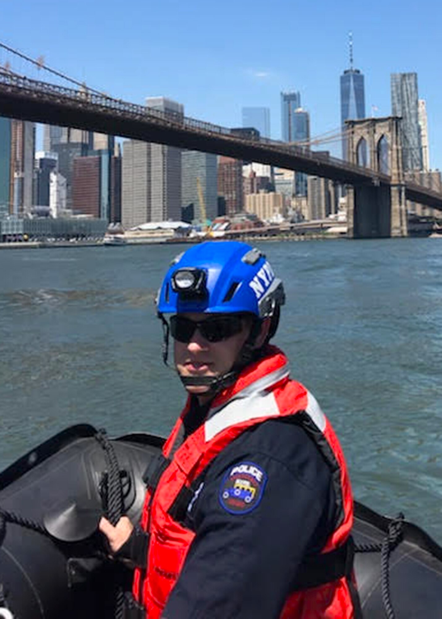U.S. Air Force Tech. Sgt. Bill Reed, 82nd Expeditionary Rescue Squadron Det. 1 Tactical Air Control Party joint terminal attack controller, rides in a New York City Police Department boat. When he is not deployed, Reed is a detective in the NYPD’s Emergency Services Unit. (Courtesy photo)
