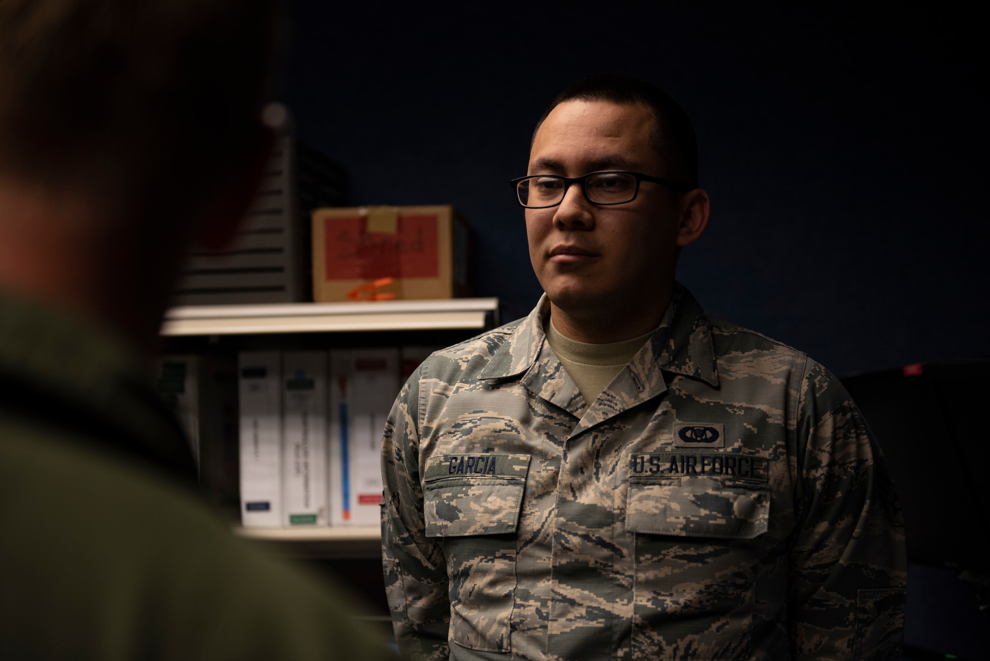 U.S. Air Force Senior Airman Alan Garcia, 325th Fighter Wing Tyndall Command Center junior emergency actions controller, right, briefs U.S. Air Force Col. Brain Laidlaw, 325th Fighter Wing commander, left, at Tyndall Air Force Base, Florida, Jan. 24, 2020. Garcia, originally from El Paso, Texas, was selected to participate in the wing's Airman Shadow program because of his dedication to the command and control mission. (U.S. Air Force photo by Staff Sgt. Magen M. Reeves)
