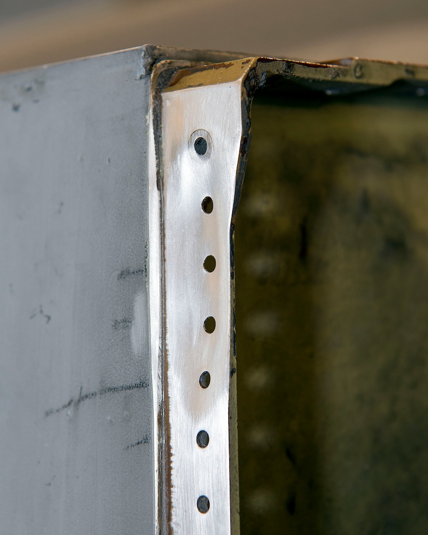 A piece of the bulkhead of an F-16 Fighting Falcon aircraft from the 140th Wing, Colorado Air National Guard, is inspected Sept. 12, 2019, at Buckley Air Force Base in Aurora, Colorado. The 446 bulkhead is the aft fuselage structure of the F-16 that supports the tail structure and recent tests have indicated an increased amount of stress cracks in this area.