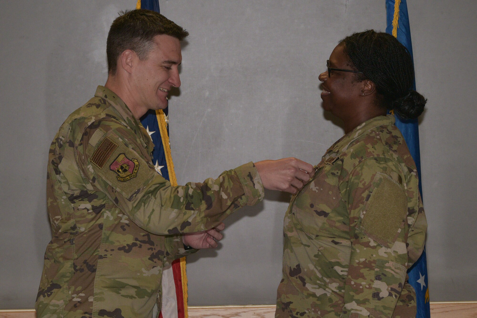 Maj. Christopher James, 45th Comptroller Squadron commander, pins the Bronze Star Medal on Master Sgt. Racquel Farquharson, 45th CPTS financial operations flight chief, January 10, 2020 at Patrick Air Force Base, Fla. Farquharson was awarded the Bronze Star Medal for meritorious achievement during her deployment. (U.S. Air Force by Senior Airman Dalton Williams)