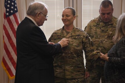 Minnesota National Guard Soldier Katie Blackwell honored her family's legacy of military service dating back to the American Revolution by having her grandfather, Ford Elliott, help to promote her to the rank of sergeant major on his 90th birthday at a January 2020 ceremony in Champlin, Minn.