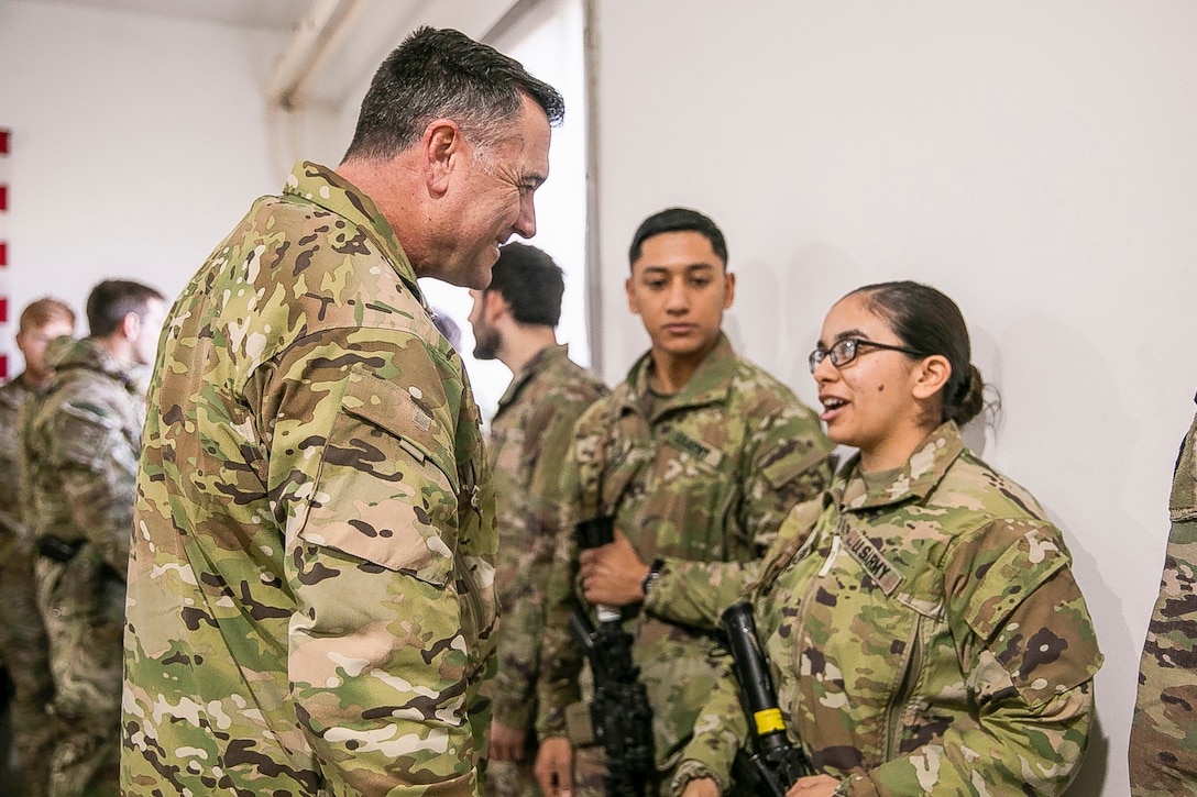 U.S. Air Force Maj. Gen. Eric T. Hill, the commanding general of Special Operations Joint Task Force – Operation Inherent Resolve, left, talks with Soldiers forward deployed to the U.S. Central Command Area of responsibility, Jan. 25, 2020. (U.S. Marine Corps photo by Sgt. Roderick Jacquote)