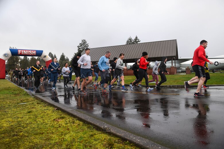 Airmen, Soldiers, and family members begin the 5K run held for Martin Luther King Jr. Day obervance at Heritage Hill on Joint Base Lewis-McChord, Wash., Jan. 24, 2020. The observance events held for Martin Luther King Jr. Day was intended to reflect on the meaning of the holiday and Martin Luther King Jr.’s influence and relevance. (U.S. Air Force photo by Airman 1st Class Mikayla Heineck)