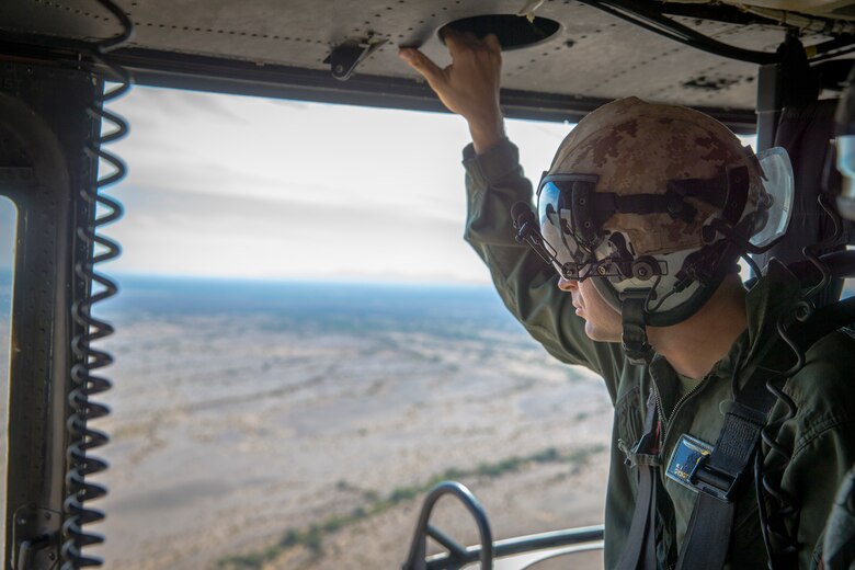 U.S. Marines with Marine Test and Evaluation Squadron (VMX) 1 conduct aerial training in a UH-1Y over the Sonoran Desert, Az., on Nov. 15, 2019. VMX-1 is an operational test squadron that tests  multiple aircraft to allow the continuation of improving the safety, reliability, and lethality of the aircraft. (U.S. Marine Corps photo by Lance Cpl John Hall)