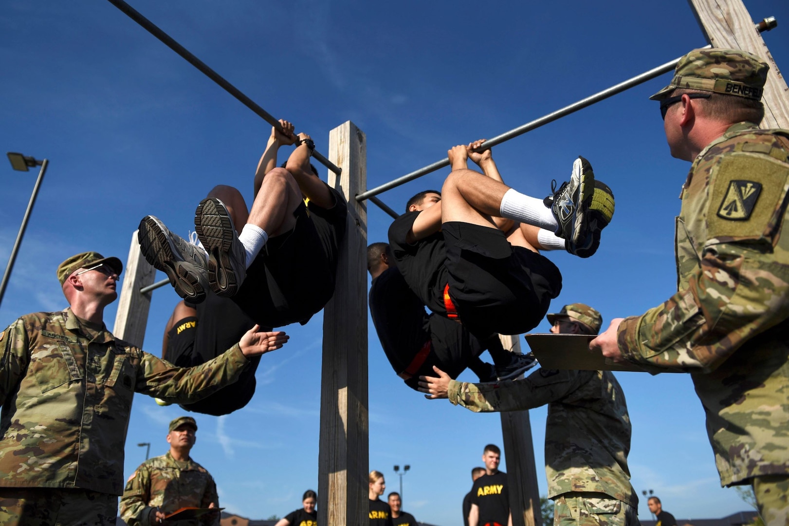 U.S. Army Advanced Individual Training students perform leg tucks during an Army Combat Fitness Test at Joint Base Langley-Eustis, Virginia, June 28, 2019. Leg tucks are the fifth event in the ACFT as it is a test of upper body and core muscle endurance that requires Soldiers to complete as many repetitions as possible in two minutes.