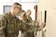 Match Officials (left) at the Southport Gun Club brief Sgt. 1st Class Rosendorn, Maj. Zizkovsky, Cmd. Sgt. Maj. Fall, and Master Sgt. Brunet during their Open Sectional Indoor Pistol Championship. Events like this are open to the public and held around the country. All Army Reserve Soldiers can benefit by attending.