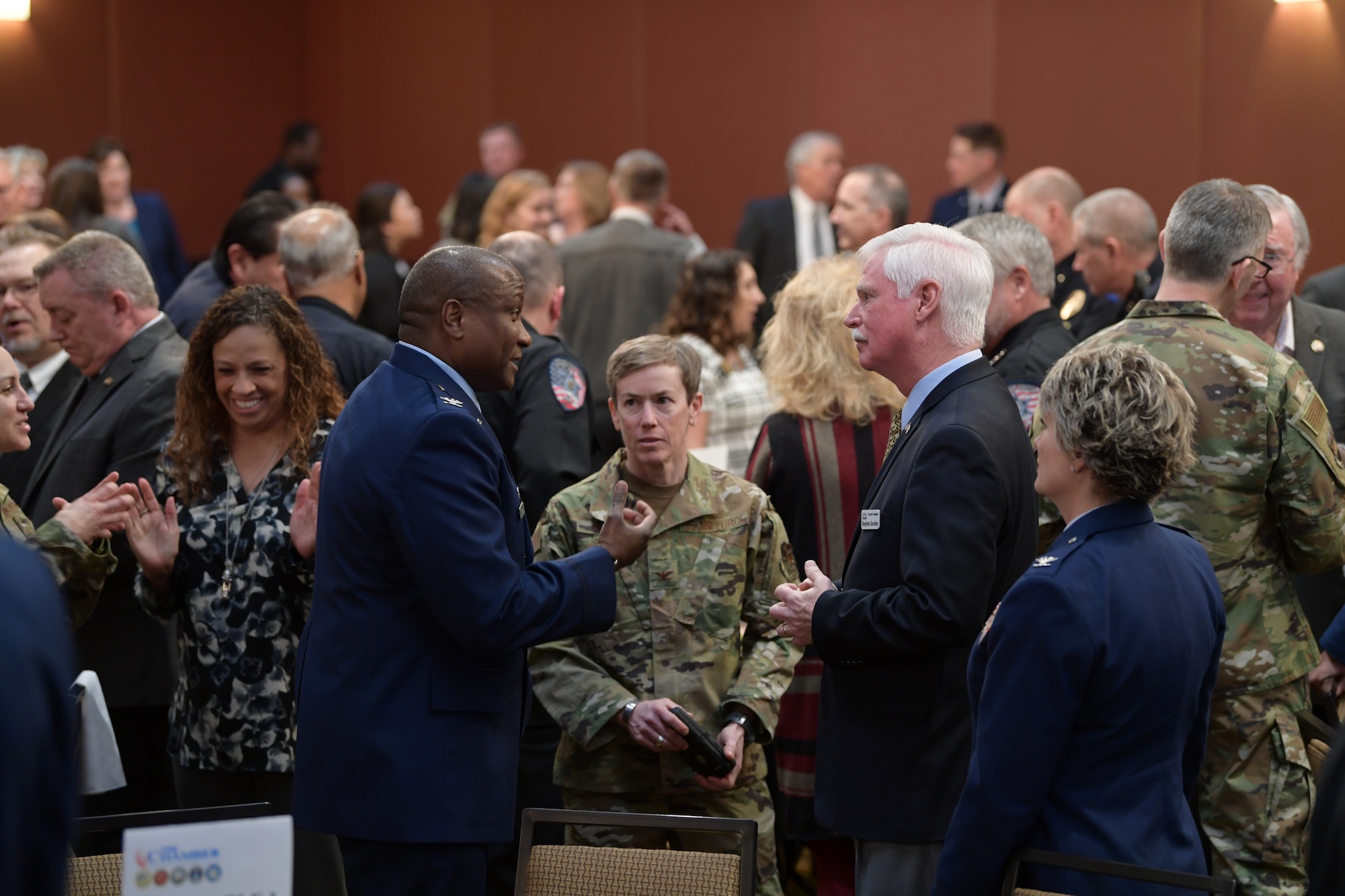 Local community and military members mingle prior to the start of the annual State of the Base luncheon at the Radisson Hotel in Aurora, Co., on Jan. 22, 2020.