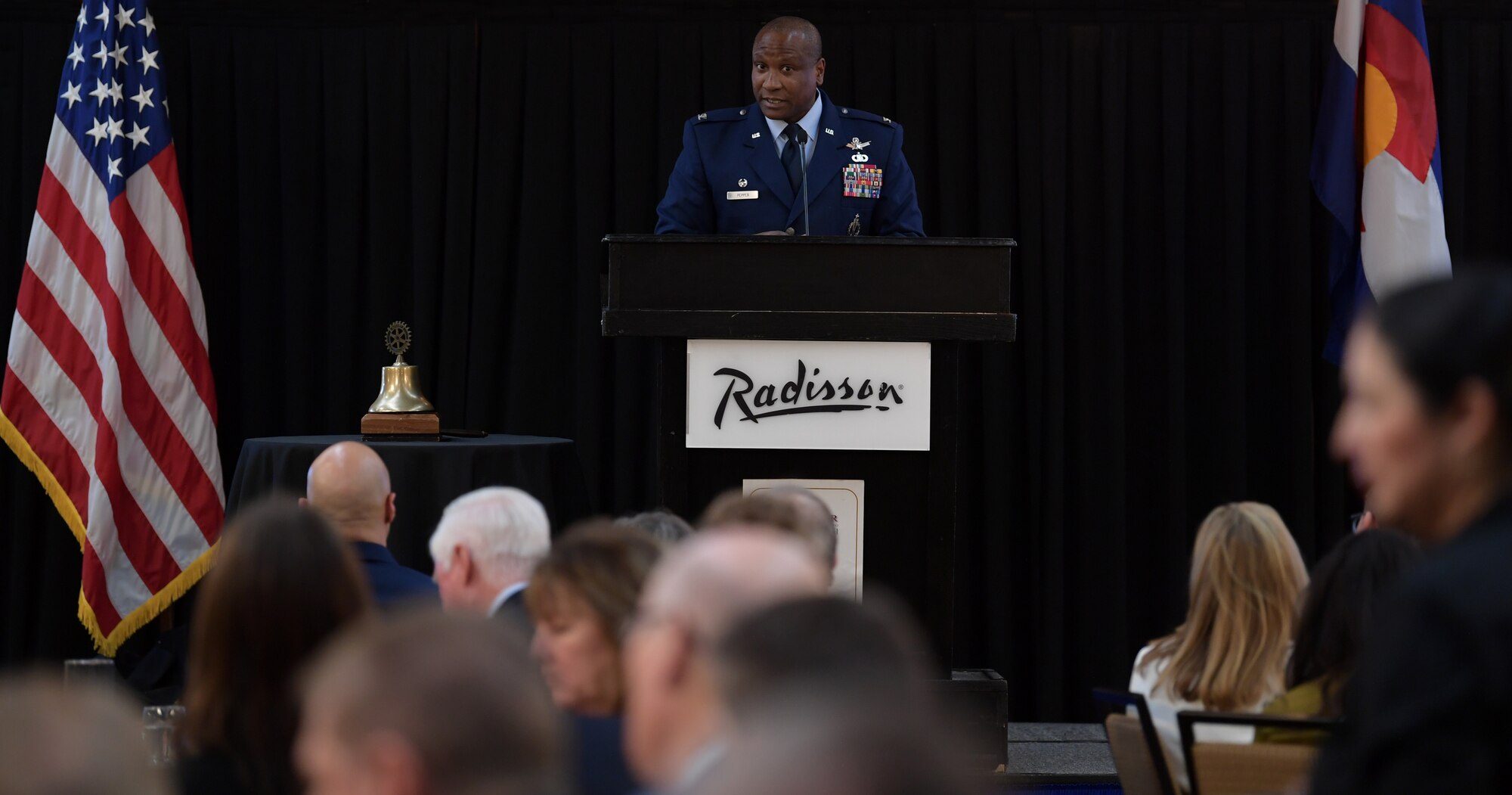 Col. Devin Pepper, 460th Space Wing commander, addresses over 250 members from the local community during the annual State of the Base luncheon at the Radisson Hotel in Aurora, Co., on Jan. 22, 2020