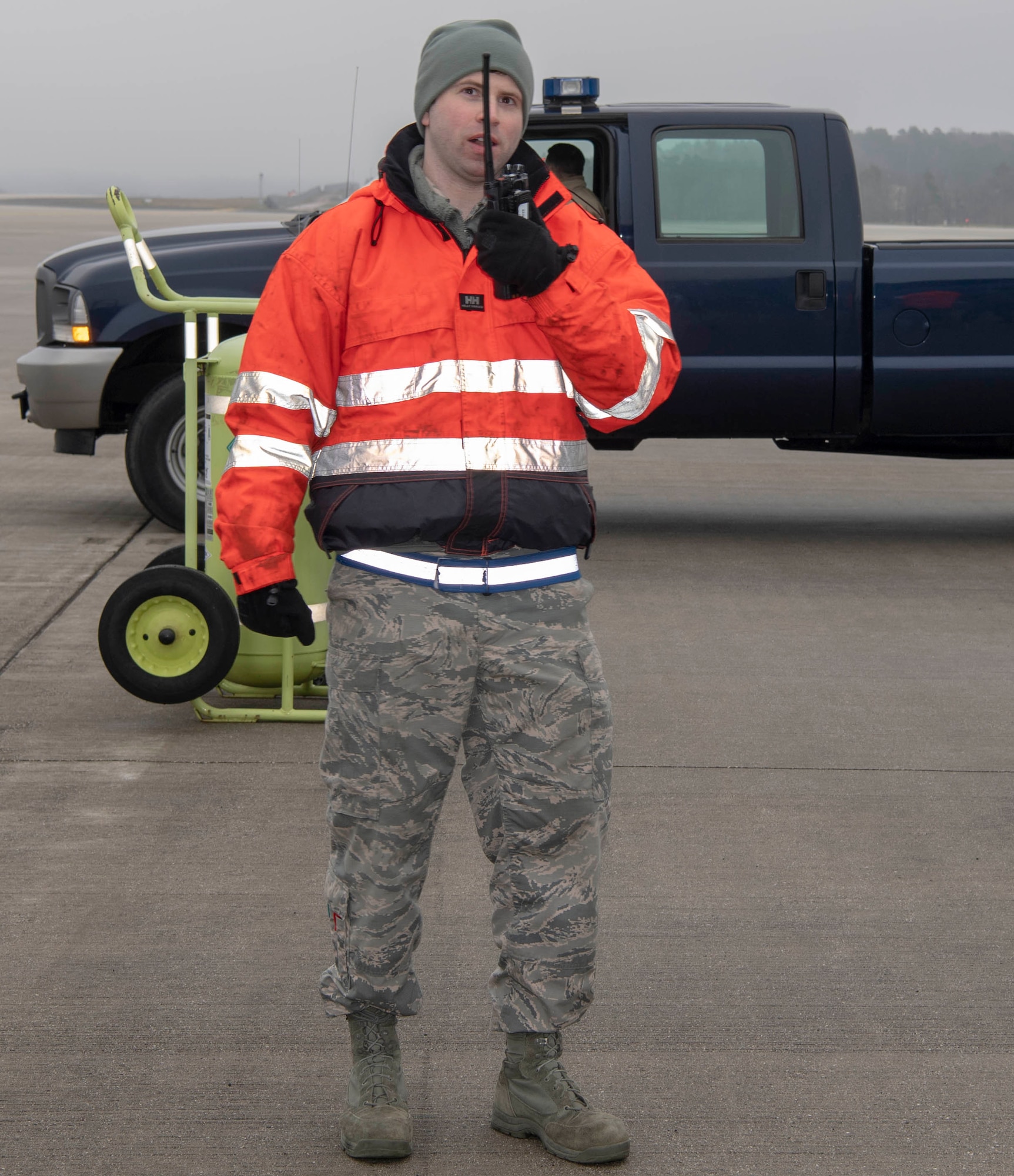 U.S. Air Force Staff Sgt. Michael Morrissey, 726th Air Mobility Squadron systems craftsman, radios in a simulated fall for a rescue exercise at Spangdahlem Air Base, Germany, Jan. 23, 2020. The fall protection exercise is part of annual training members of the 726th AMS undergo. (U.S. Air Force photo by Senior Airman Kyle Cope)