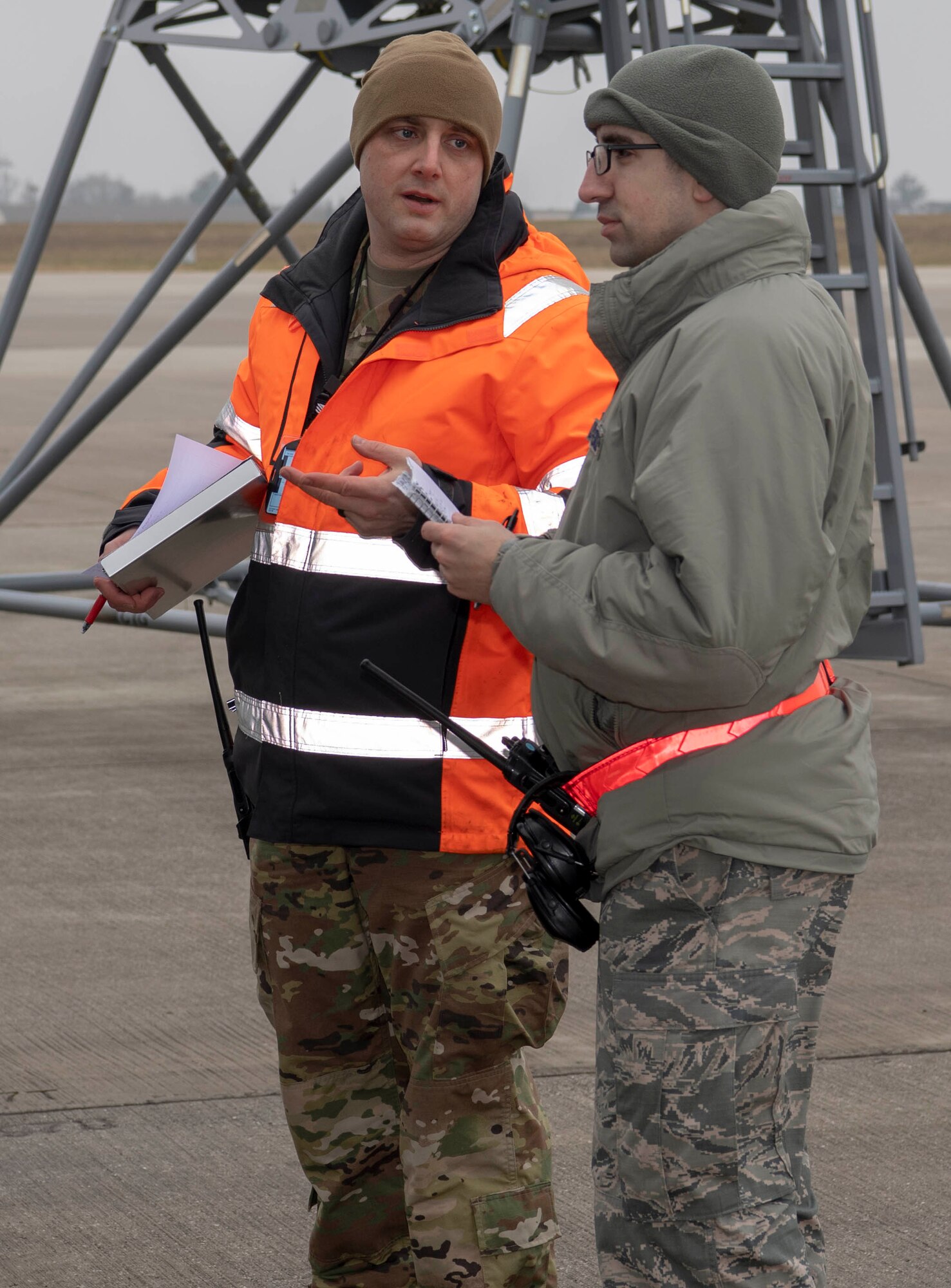 U.S. Air Force Tech. Sgt. Loren Martin, 726th Air Mobility Squadron flight line expediter, left, and Tech. Sgt. Chad Kearney, 726th AMS quality assurance inspector, right, ensure members of the 726th AMS correctly perform rescue procedures during a fall protection exercise at Spangdahlem Air Base, Germany, Jan. 23, 2020. The annual exercise is intended to help Airmen be better prepared to rescue their wingman if someone falls off an aircraft wing during an aircraft inspection. (U.S. Air Force photo by Senior Airman Kyle Cope)