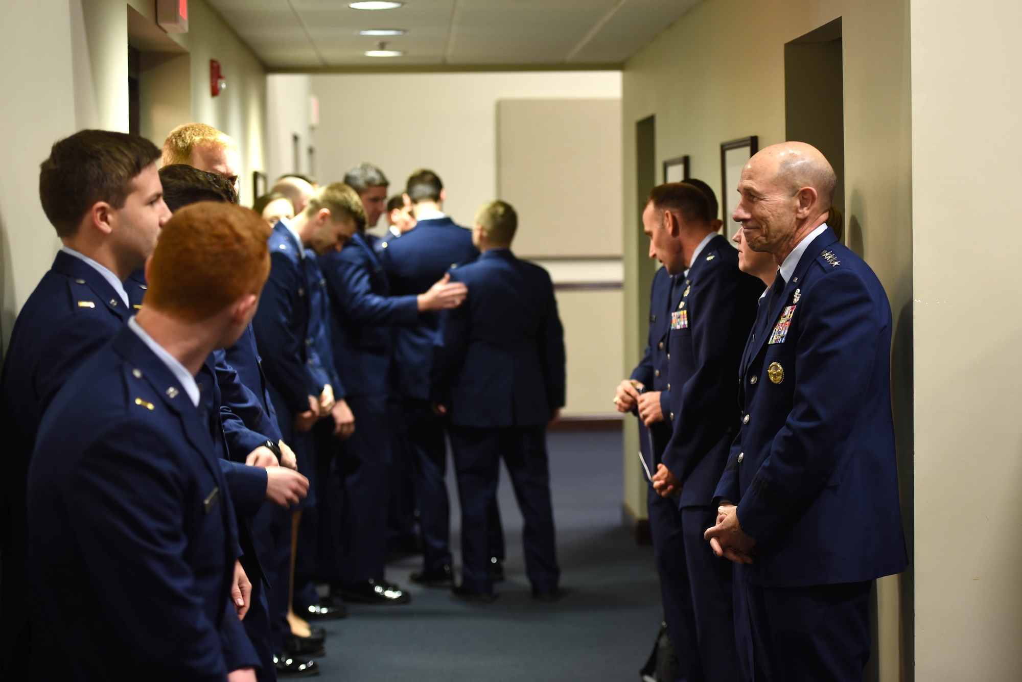 U.S. Air Force Gen. Mike Holmes, the commander of Air Combat Command, stands with Specialized Undergraduate Pilot Training class 20-06/07 before their graduation ceremony at the Kaye Auditorium Jan. 24, 2020, on Columbus Air Force Base, Mississippi. Holmes was the guest speaker at the graduation, delivering inspirational messages to the next generation of pilots. (U.S. Air Force photo by Airman 1st Class Jake Jacobsen)