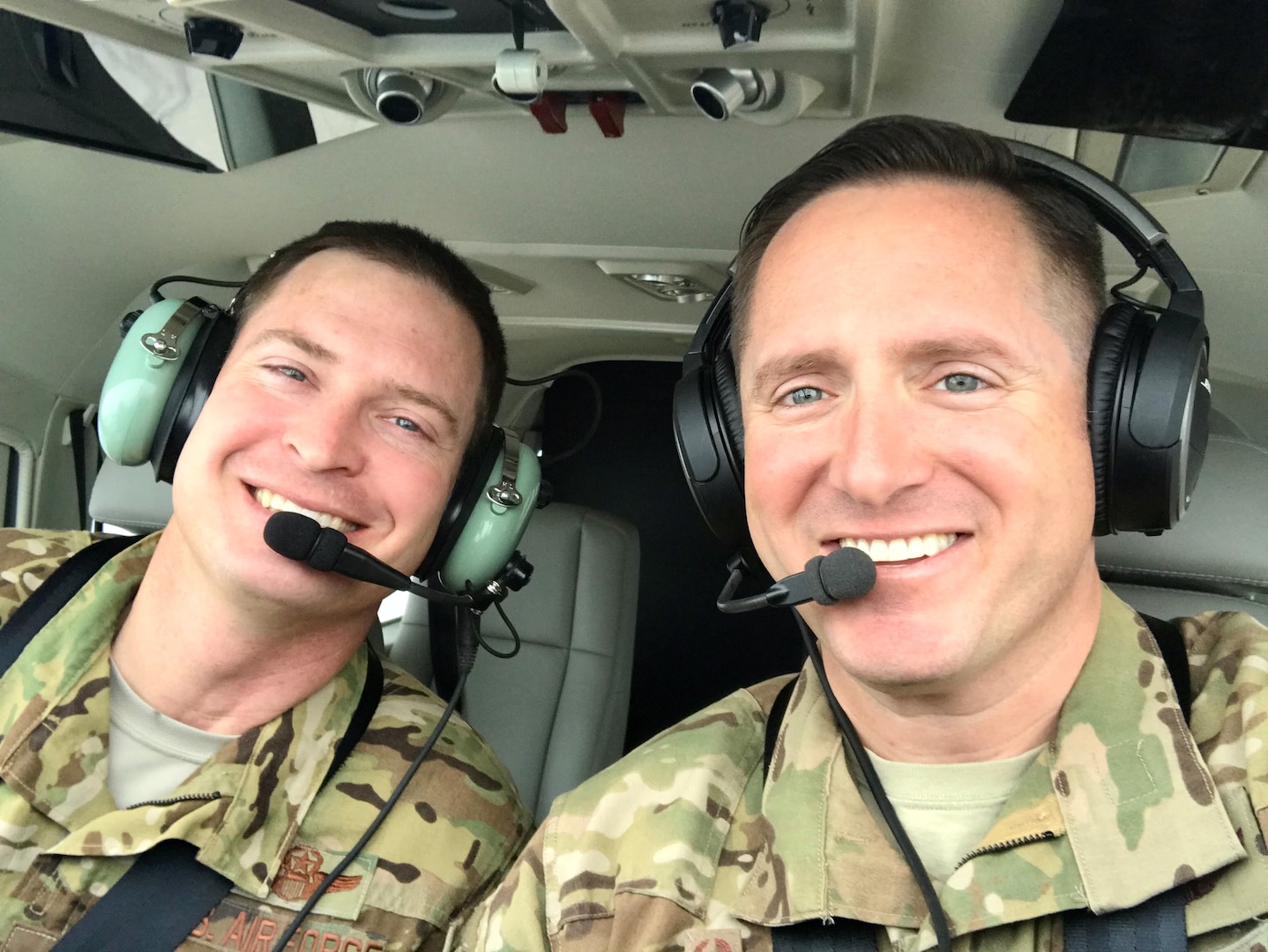 U.S. Air Force Lt. Col. Carl Miller (right), 538th Air Expeditionary Advisory Squadron commander, prepares for a training sortie in an AC-208 Super Caravan with U.S. Air Force Lt. Col. Sam McIntyre, 538th AEAS director of operations, on the flight line at Hamid Karzai International Airport in Kabul, Afghanistan in this undated photo. Miller was named a 2019 Lance P. Sijan United States Air Force Leadership Award winner in the senior officer category. (Courtesy Photo)