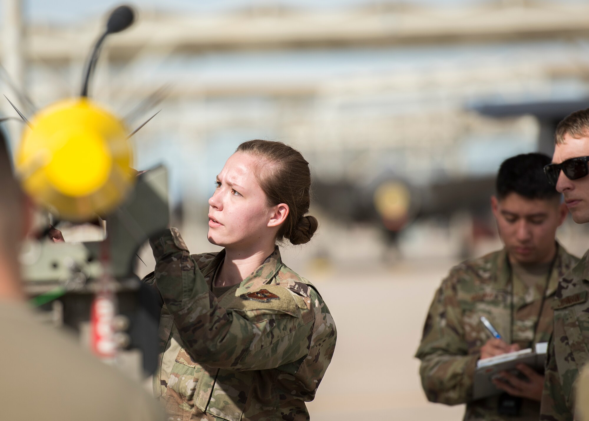 Airman 1st Class Amanda Knutson, 63rd Aircraft Maintenance Unit weapons load crew member, prepares an inert munition for loading onto an F-35A Lightning II during the Annual Load Crew Competition, Jan. 24, 2020, at Luke Air Force Base, Ariz.