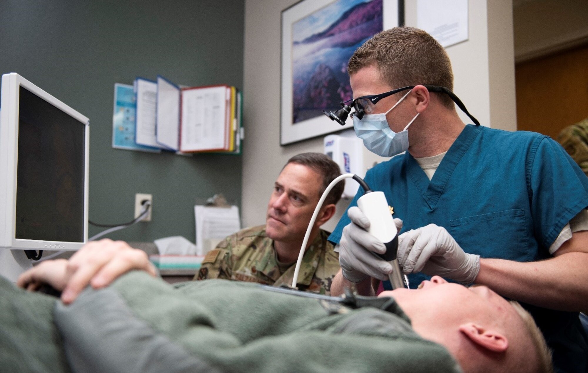U.S. Air Force Maj. Steven Savage, 21st Medical Squadron general dentist, demonstrates the Sirona Unit Computer Aided Design/Computer Aided Milling Crown unit to Col. Thomas Falzarano, 21st Space Wing commander, during his visit to the 21st MDS at Schriever Air Force Base, Colorado, Jan. 22, 2020. With the help of the unit, the 21st MDS is able to provide patients who need crowns the same day at Schriever AFB. This technology reduced the amount of Schriever Airmen on dental profiles. (U.S. Air Force photo by Airman Amanda Lovelace)