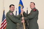 Military officer receives guidon flag