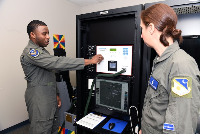Two Airmen working with ROBD
