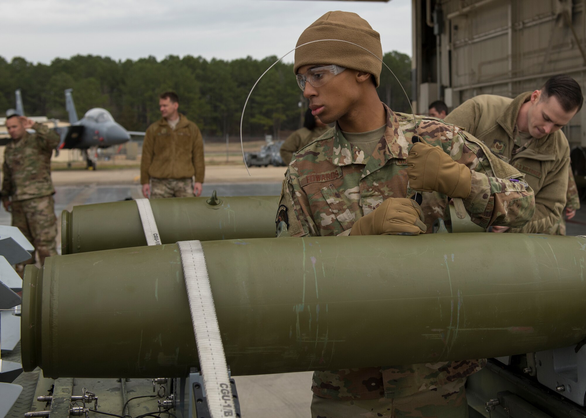 Airman 1st Class Jaden Edwards, 4th Munitions Squadron precision guided munitions technician, assembles munitions during a quarterly Load Crew Competition.