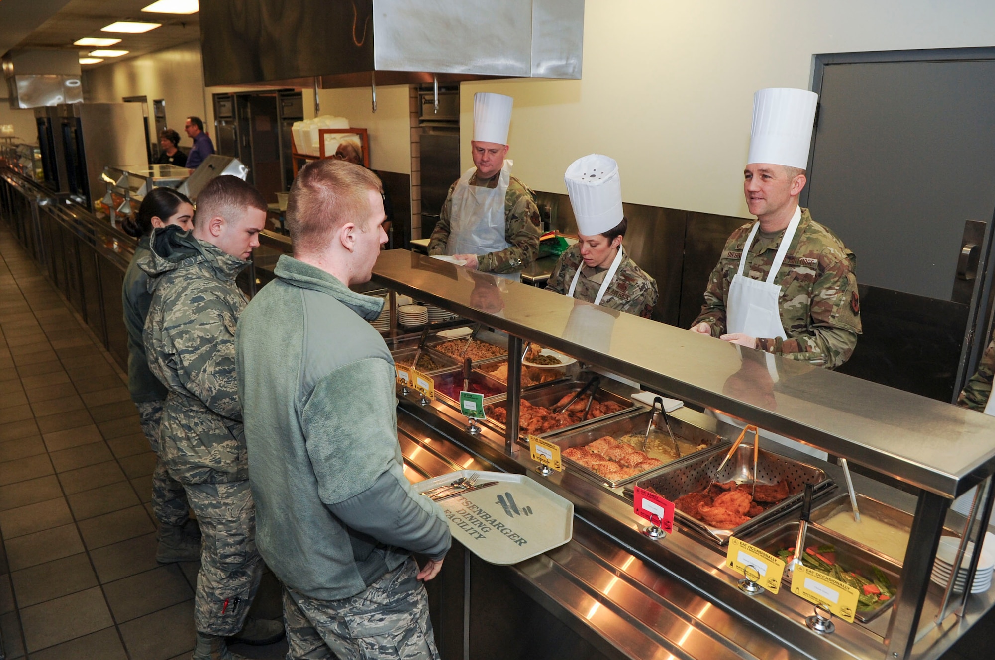 Group commanders, superintendents and first sergeants from the National Air and Space Intelligence Center, prepare food at the Pitsenbarger Dining Facility on Wright-Patterson Air Force Base, Ohio on Jan. 24, 2020.  The group was able to use their role as servers for a day as a way to get out amongst Airmen in a more relaxed and open environment. (U.S. Air Force photo Staff Sgt. Seth Ray Stang)