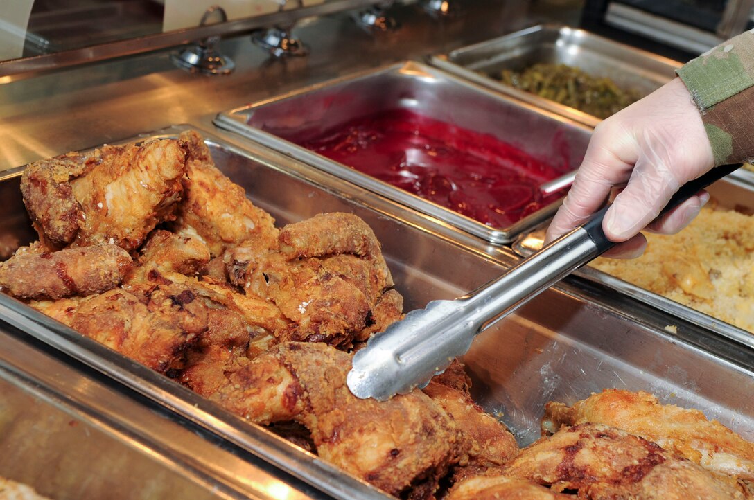 Group commanders, superintendents and first sergeants from the National Air and Space Intelligence Center, prepare food at the Pitsenbarger Dining Facility on Wright-Patterson Air Force Base, Ohio on Jan. 24, 2020. The group was able to use their role as servers for a day as a way to get out amongst Airmen in a more relaxed and open environment. (U.S. Air Force photo Staff Sgt. Seth Ray Stang)