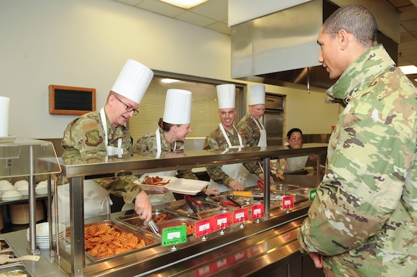Group commanders, superintendents and first sergeants from the National Air and Space Intelligence Center, prepare food at the Pitsenbarger Dining Facility on Wright-Patterson Air Force Base, Ohio on Jan. 24, 2020.  The group was able to use their role as servers for a day as a way to get out amongst Airmen in a more relaxed and open environment. (U.S. Air Force photo Staff Sgt. Seth Ray Stang)