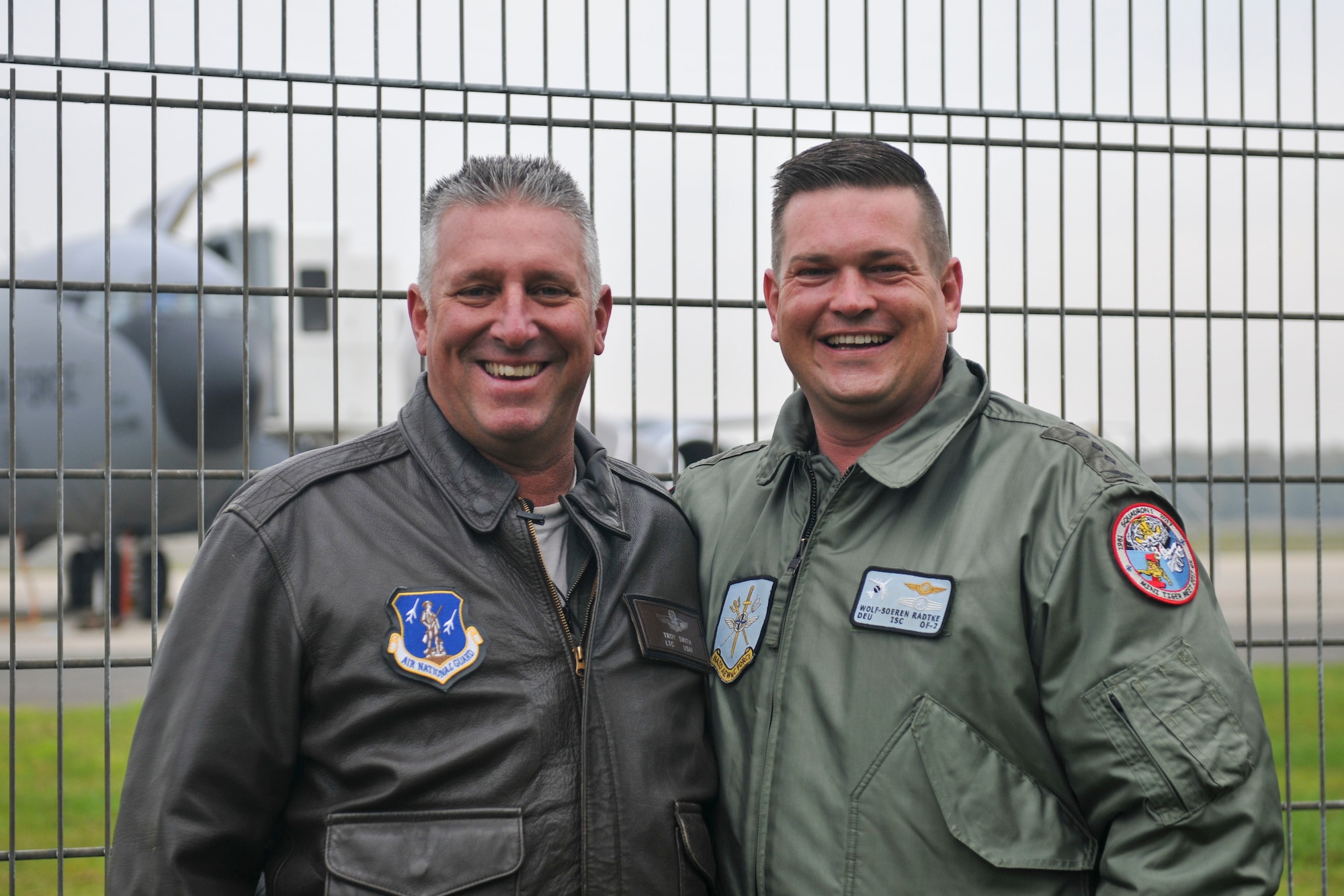 U.S. Air Force Lt. Col. Troy Smith poses with German Air Force Capt. Wolf-Soren Radke Nov. 19, 2019, at NATO Air Base Geilenkirchen. Smith and Radke are continuing a friendship their fathers, who were also military members, started years ago. (U.S. Air National Guard photo by Senior Airman Christi Richter)