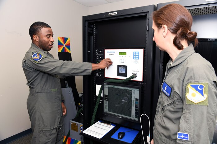 Two Airmen working with ROBD