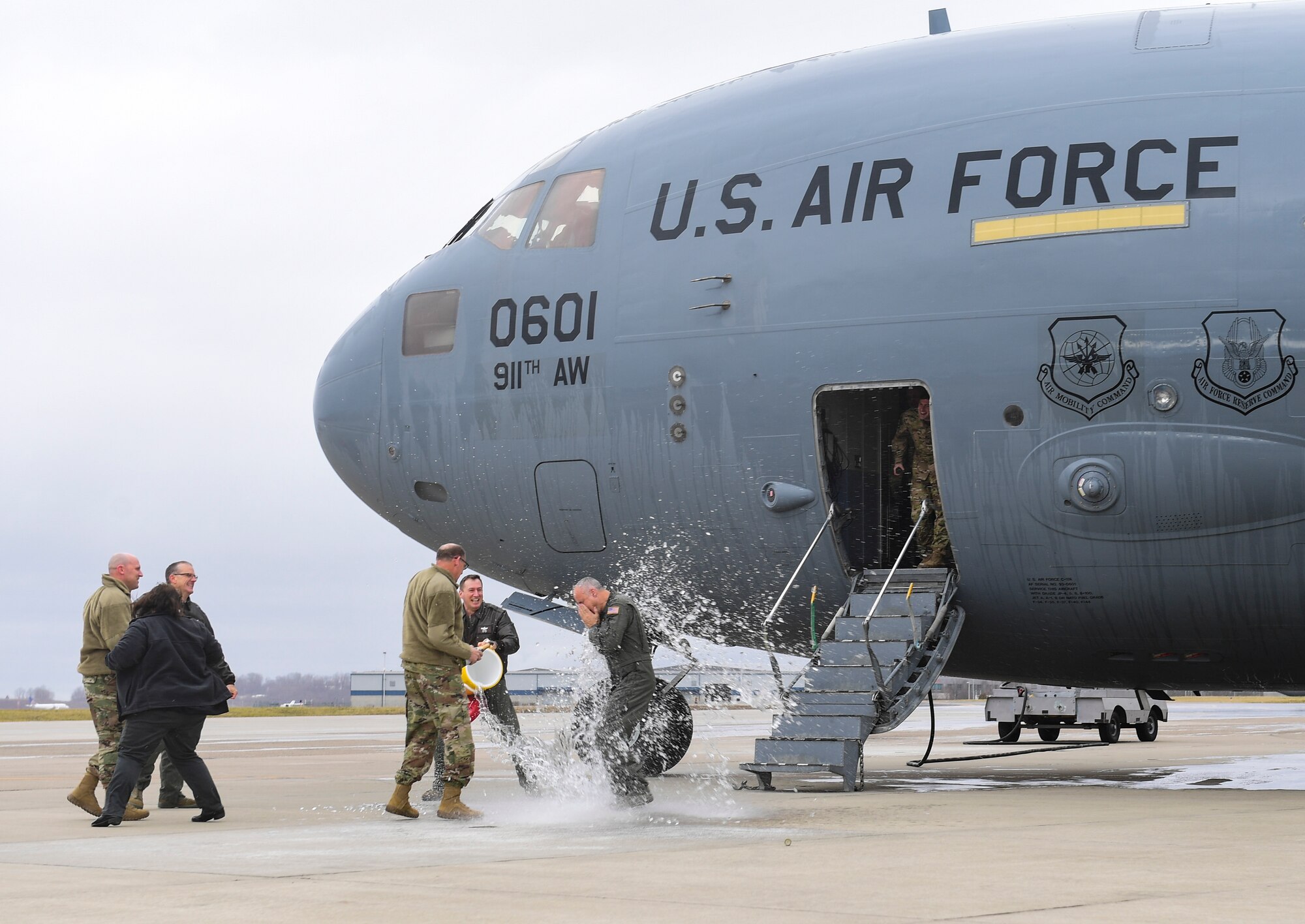 Col. Jay D. Miller, 911th Airlift Wing vice commander, is drenched in water upon returning from his fini-flight at the Pittsburgh International Airport Air Reserve Station, Pennsylvania, Jan. 12, 2020. This was Millers’s final flight as the vice commander of the 911th AW.