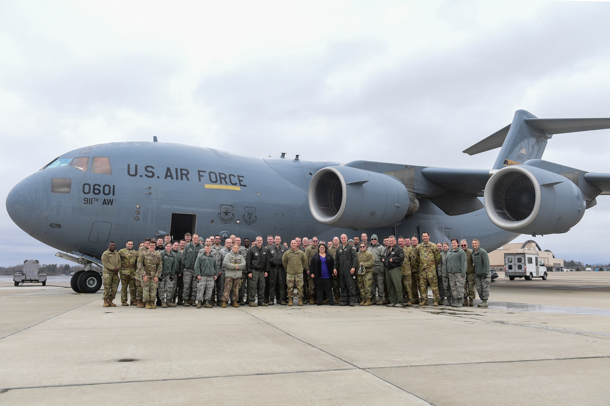 Members of the 911th Airlift Wing pose for a photo with Col. Jay D. Miller, 911th AW vice commander, after his fini-flight at the Pittsburgh International Airport Air Reserve Station, Pennsylvania, Jan. 12, 2020. The members took this time to celebrate Miller’s time as the vice commander and say their goodbyes to him