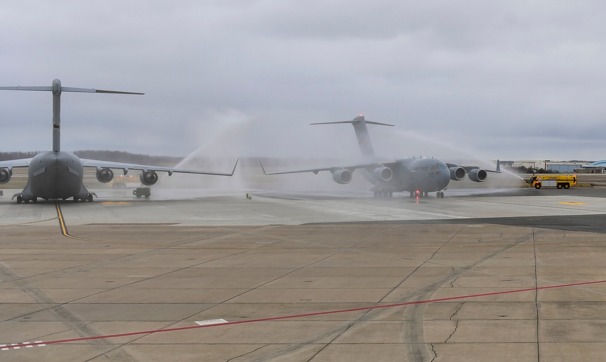 A C-17 Globemaster III piloted by Col. Jay D. Miller, 911th Airlift Wing vice commander, taxis under arcs of water as it returns to the flight line at the Pittsburgh International Airport Air Reserve Station, Pennsylvania, Jan. 12, 2020. This was Miller’s final flight as the vice commander of the 911th AW.