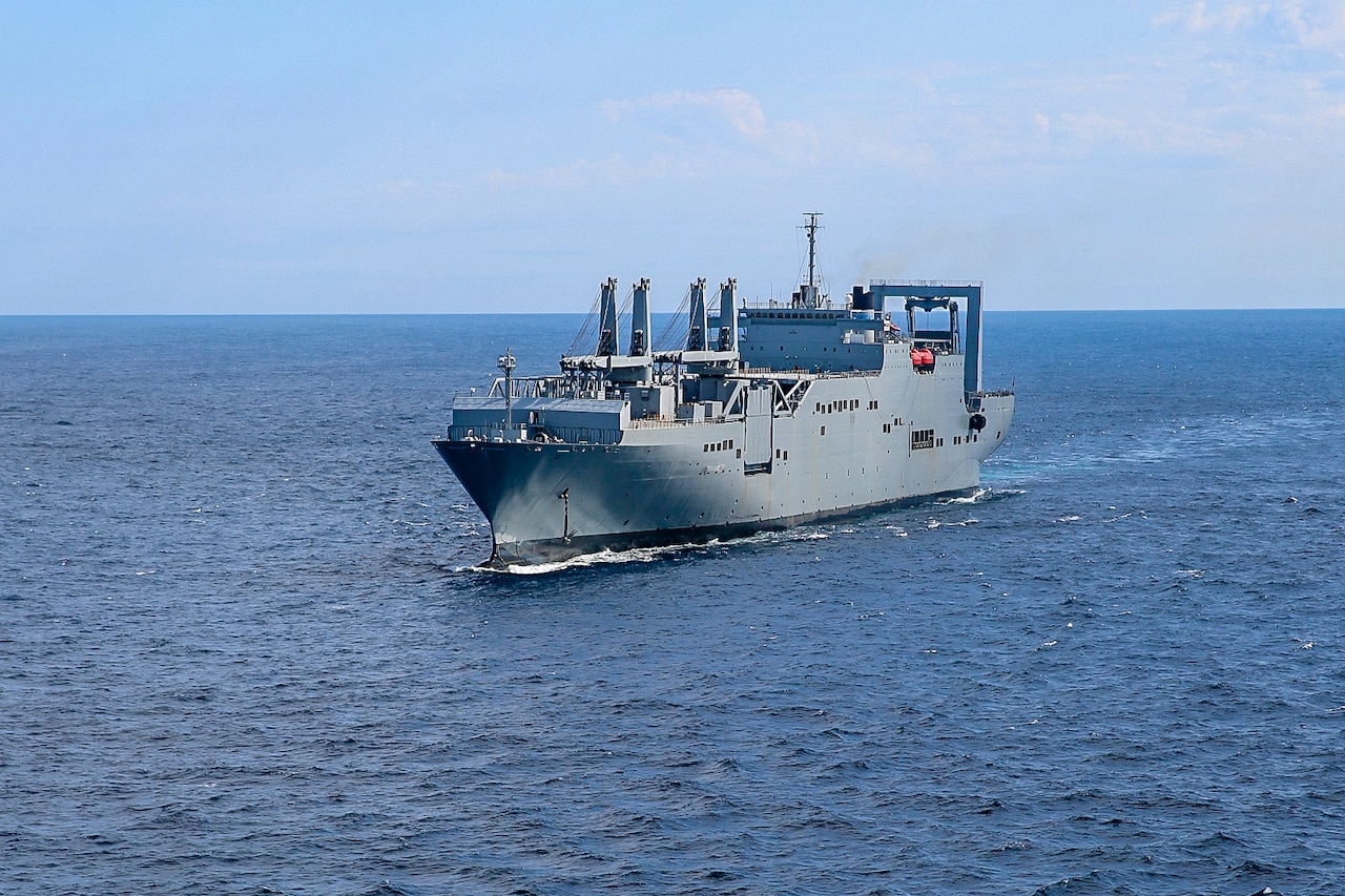 A large ship moves through the water.