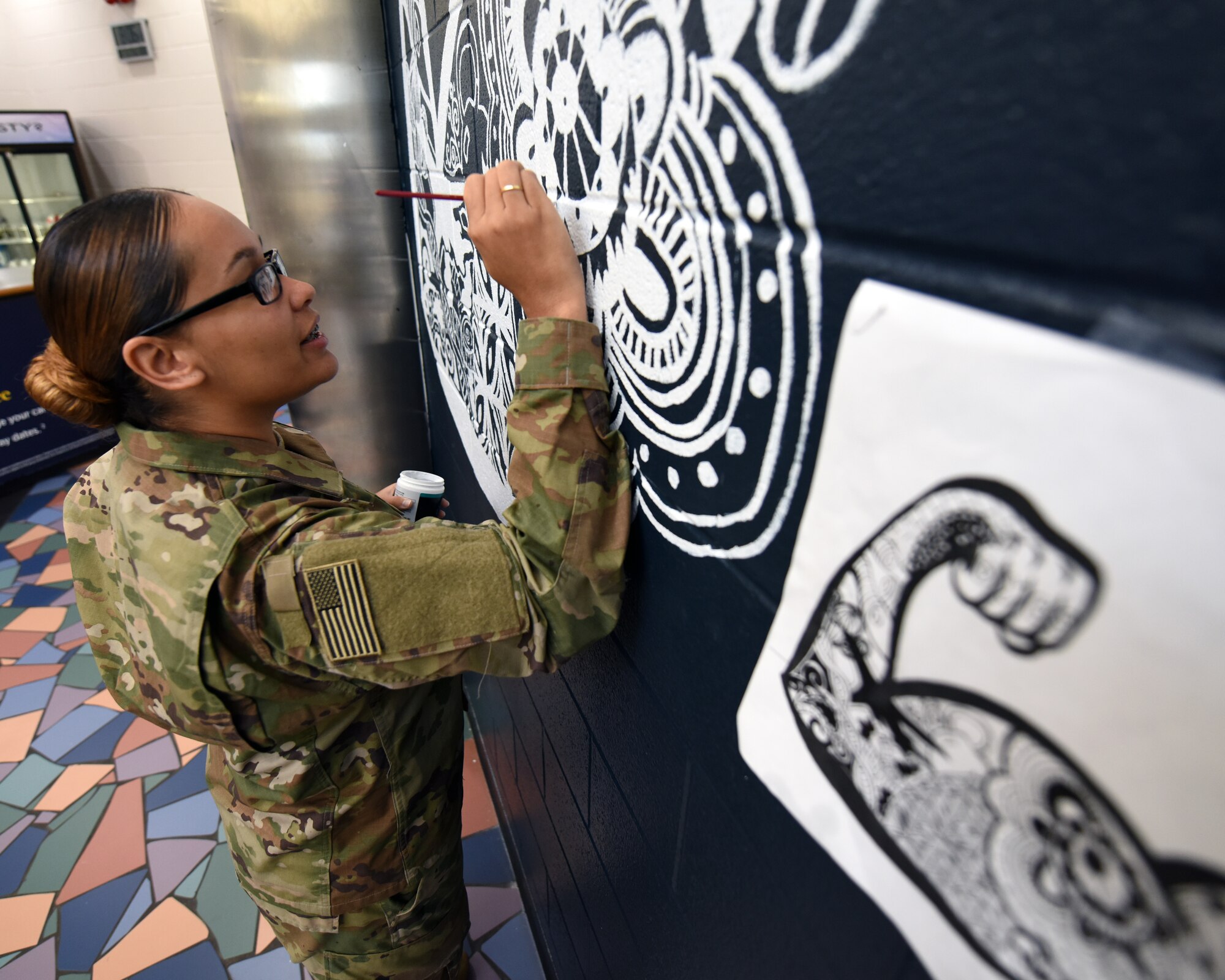 Airman paints gym mural