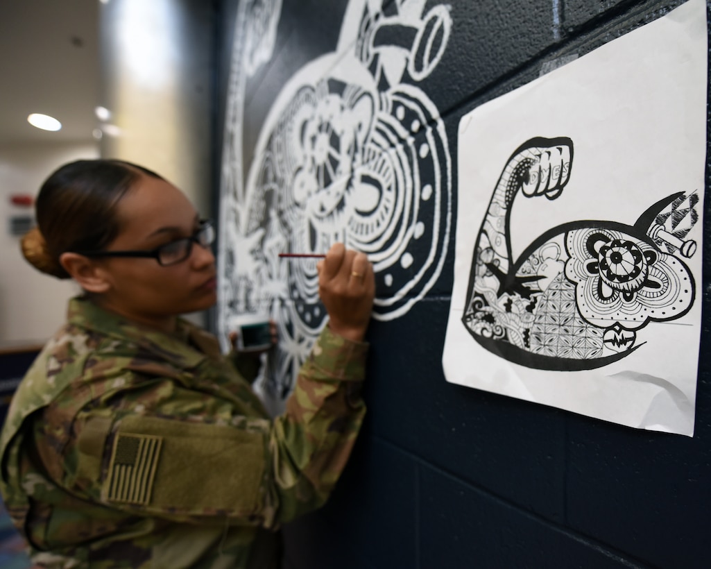 Airman paints gym mural