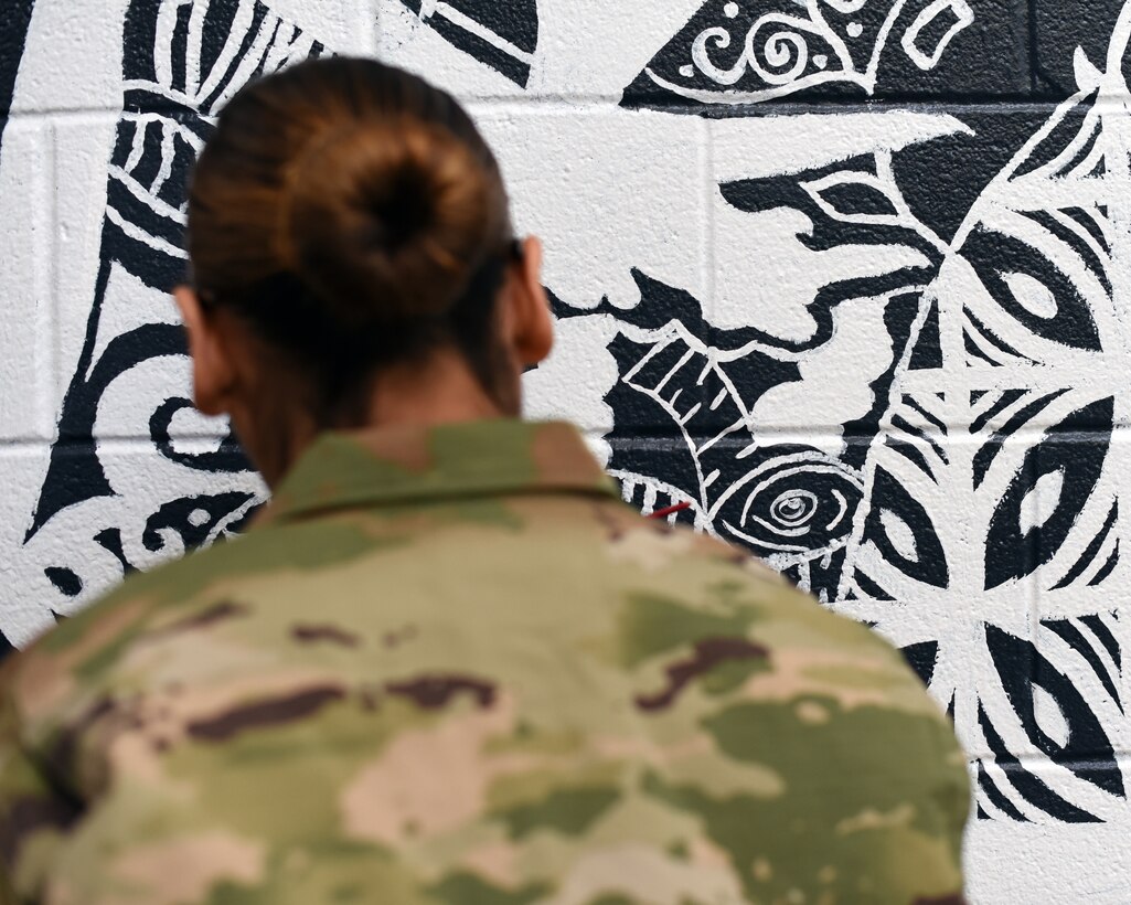 Airman paints gym mural