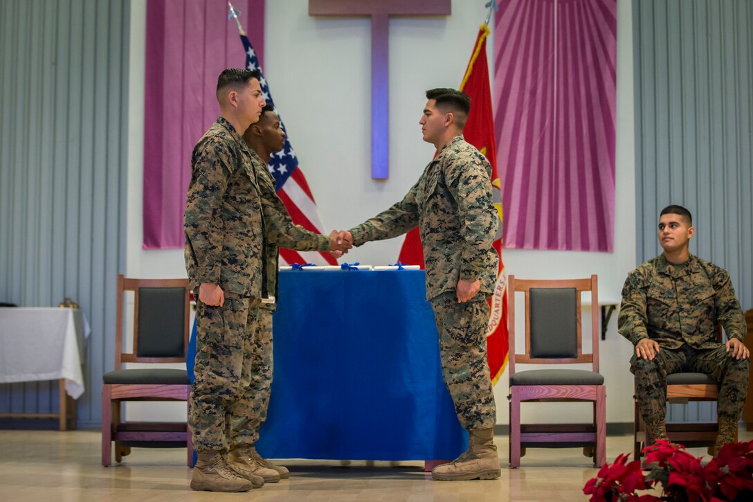 U.S. Marines stationed on Marine Corps Air Station (MCAS) Yuma graduate from Lance Corpal Seminar 1-20 at the MCAS Yuma station chapel, Dec. 6, 2019. The purpose of the course is to help junior Marines develop an understanding of what it takes to be a leader of Marines, by teaching them leadership principles and leadership traits. (U.S. Marine Corps photo by Lance Cpl John Hall)