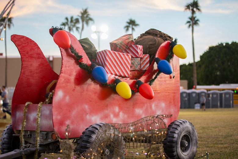 U.S. Marines, Sailors, and their families partake in holiday festivities during the Happy Holidays from Yuma event on the Marine Corps Air Station (MCAS) Yuma Parade Field, Dec. 12, 2019. The event was hosted by MCCS and provided participants with the opportunity to get photos with Santa, eat food, and enjoy holiday music. (U.S. Marine Corps photo by Lance Cpl John Hall)