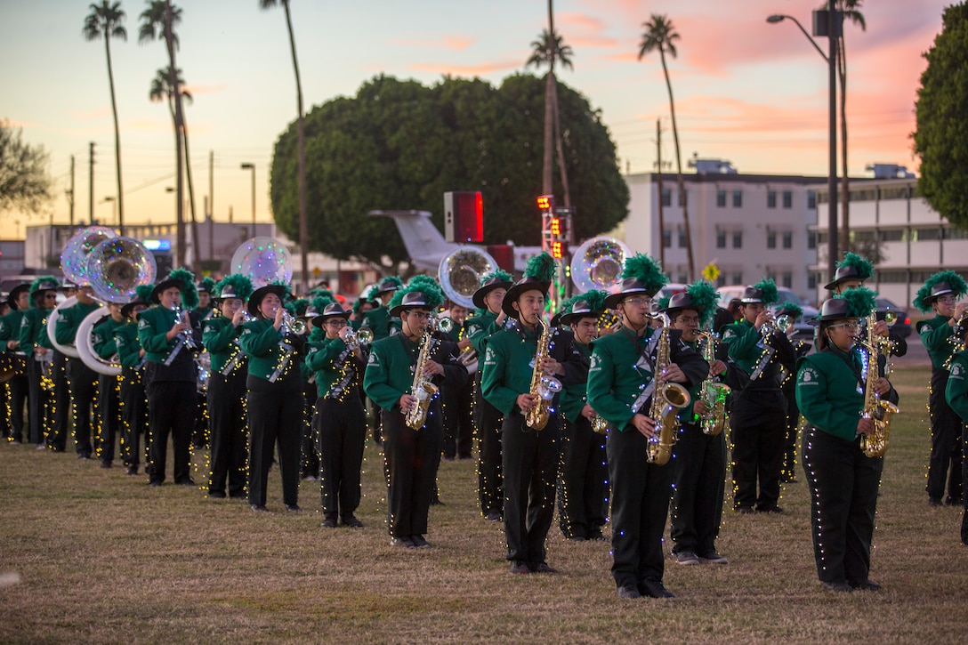 U.S. Marines, Sailors, and their families partake in holiday festivities during the Happy Holidays from Yuma event on the Marine Corps Air Station (MCAS) Yuma Parade Field, Dec. 12, 2019. The event was hosted by MCCS and provided participants with the opportunity to get photos with Santa, eat food, and enjoy holiday music. (U.S. Marine Corps photo by Lance Cpl John Hall)
