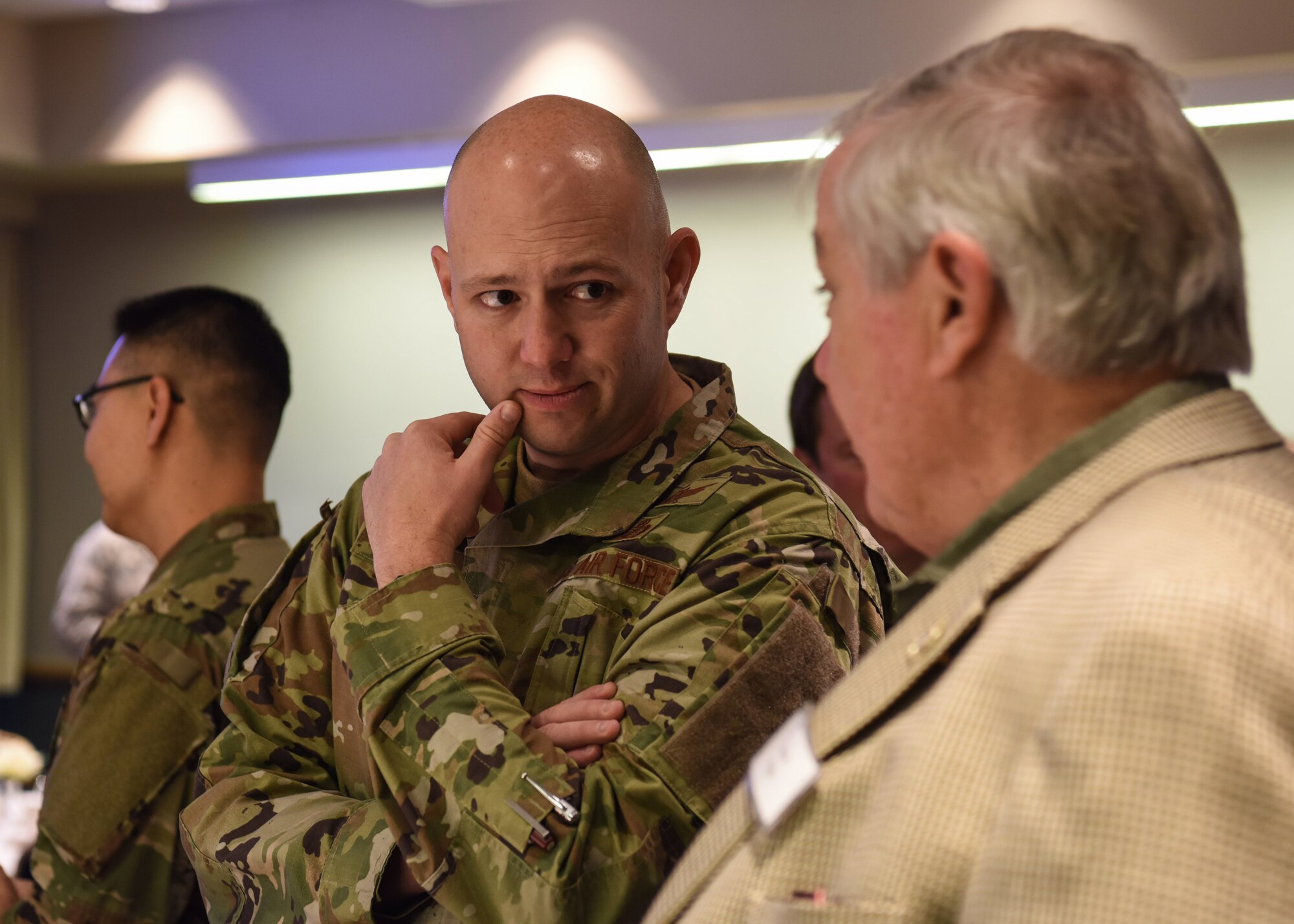 Lt. Col. Brian Chatman, 2nd Space Launch Squadron commander, converses with Steve Pepe, 2nd SLS honorary commander, at the annual honorary commanders breakfast, Jan. 24, 2020, at Vandenberg Air Force Base, Calif. The honorary commanders program matches community members with unit commanders in a symbolic command to build social and professional connections with the local community. (U.S. Air Force photo by Airman 1st Class Aubree Milks)